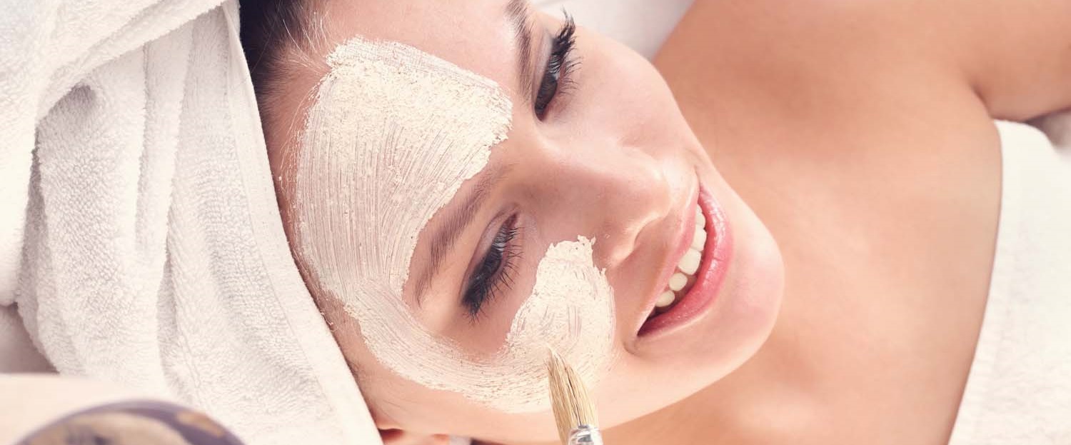 woman applying face mask