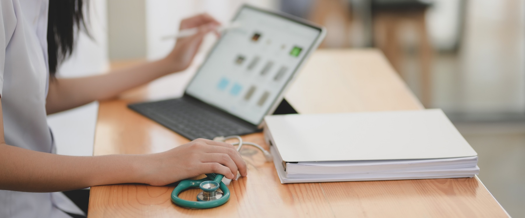 woman with laptop and stethoscope